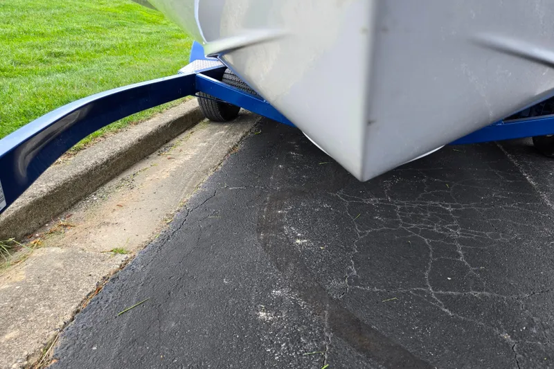 Slide: The Image of 2020 Monterey M-20 boat on trailer, parked on asphalt near grass. - 7