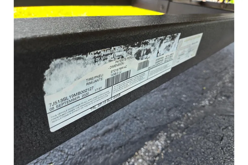 Slide: The Image of Close-up of a 2014 Sun Tracker Party Barge 20 DLX trailer label. - 10