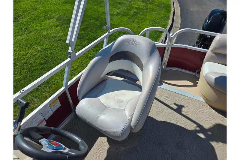 Slide: The Image of 2014 Sun Tracker Party Barge 20 DLX boat seat and steering wheel. - 17
