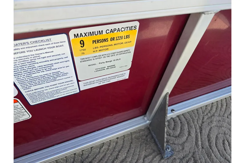 Slide: The Image of 2014 Sun Tracker Party Barge 20 DLX capacity label, showing maximum of 9 persons or 1220 lbs. - 18