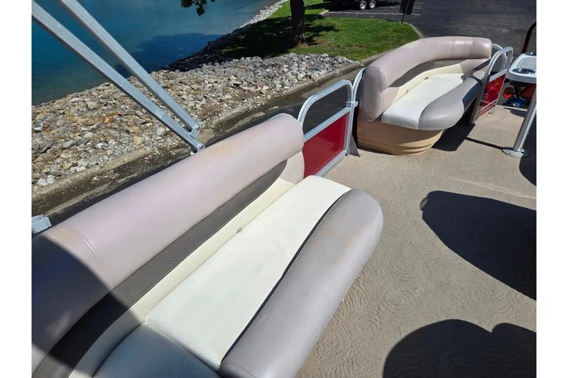 Slide: The Image of 2014 Sun Tracker Party Barge 20 DLX with beige seating and lake view. - 20