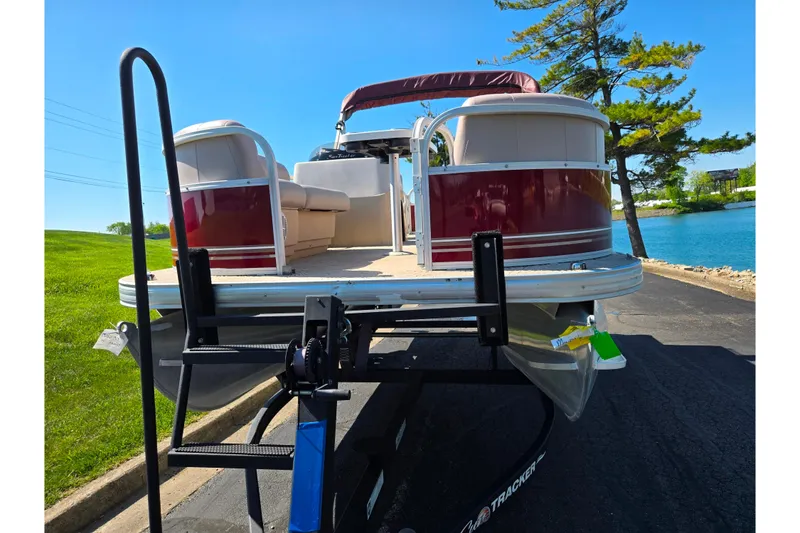 Slide: The Image of 2014 Sun Tracker Party Barge 20 DLX pontoon boat on trailer by a lake. - 8