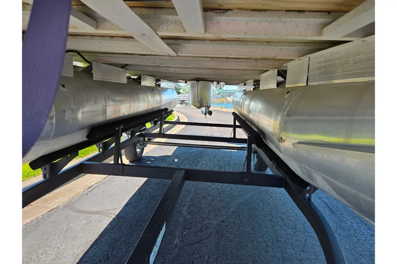 Slide: The Image of Underneath view of a 2014 Sun Tracker Party Barge 20 DLX pontoon boat on a trailer. - 9