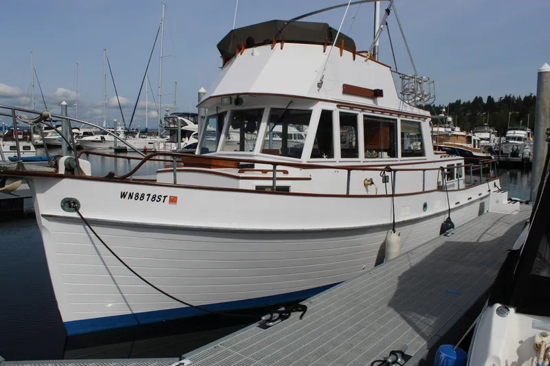 The Image of 1971 Grand Banks 36 Classic yacht docked at marina, showcasing elegant design. - 1