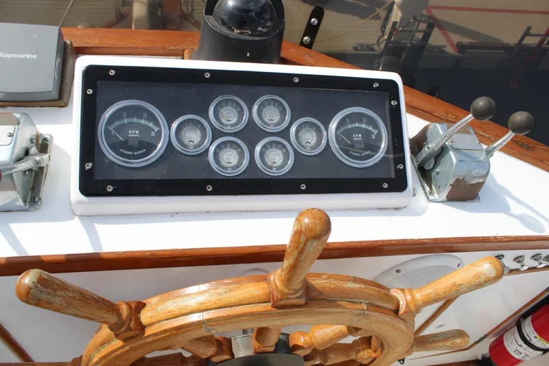 Slide: The Image of 1971 Grand Banks 36 Classic helm with wooden wheel and instrument panel. - 11