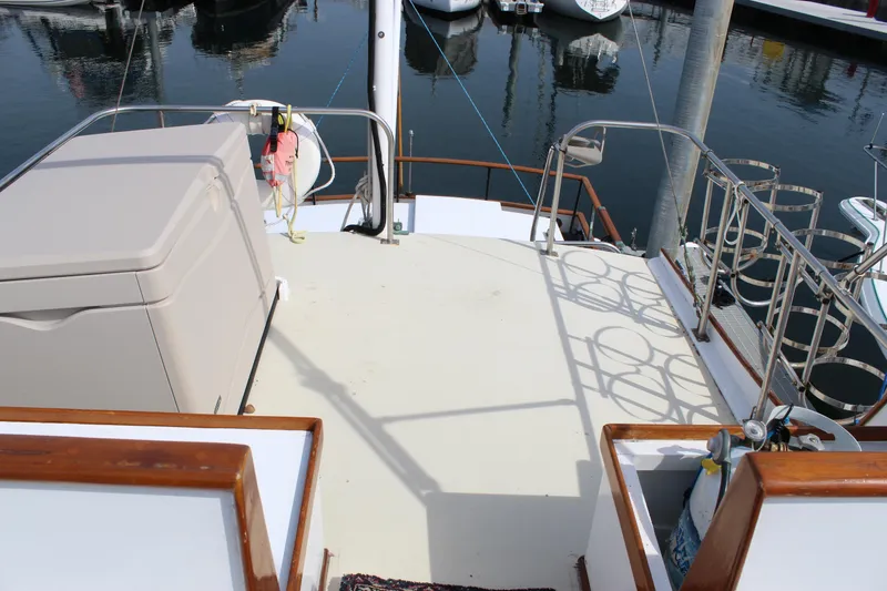Slide: The Image of Deck view of a 1971 Grand Banks 36 Classic yacht in a marina setting. - 13