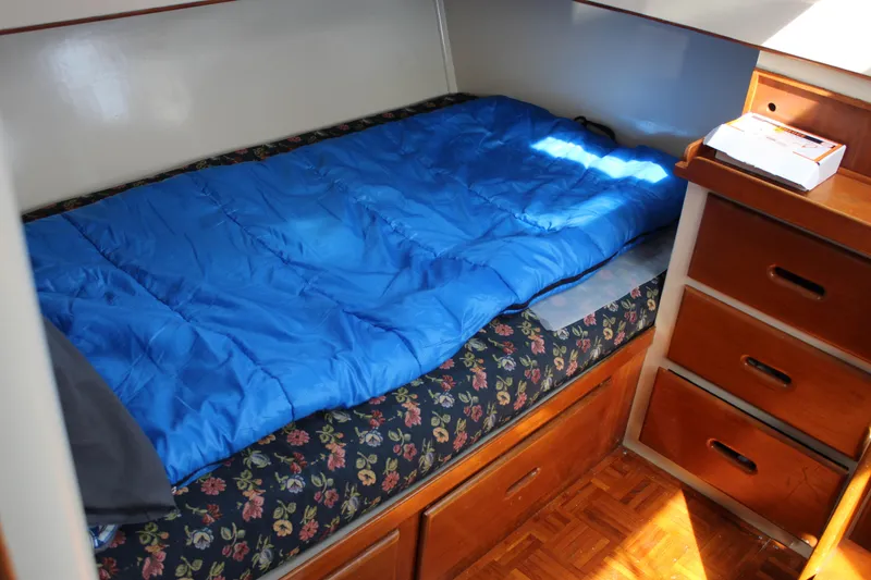Slide: The Image of Cozy cabin bed with blue sleeping bag on 1971 Grand Banks 36 Classic boat. - 25