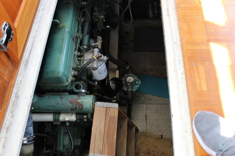 Slide: The Image of Engine compartment of a 1971 Grand Banks 36 Classic boat, showcasing mechanical components. - 29
