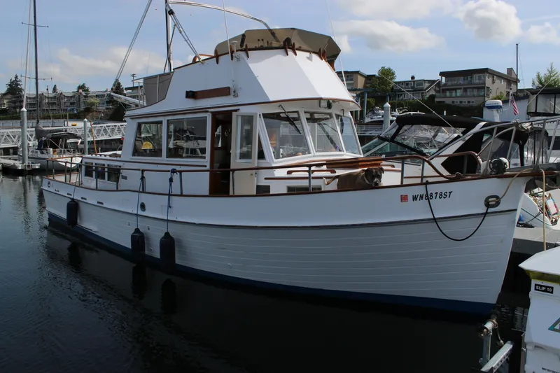 Slide: The Image of 1971 Grand Banks 36 Classic yacht docked at marina, showcasing vintage design and craftsmanship. - 3