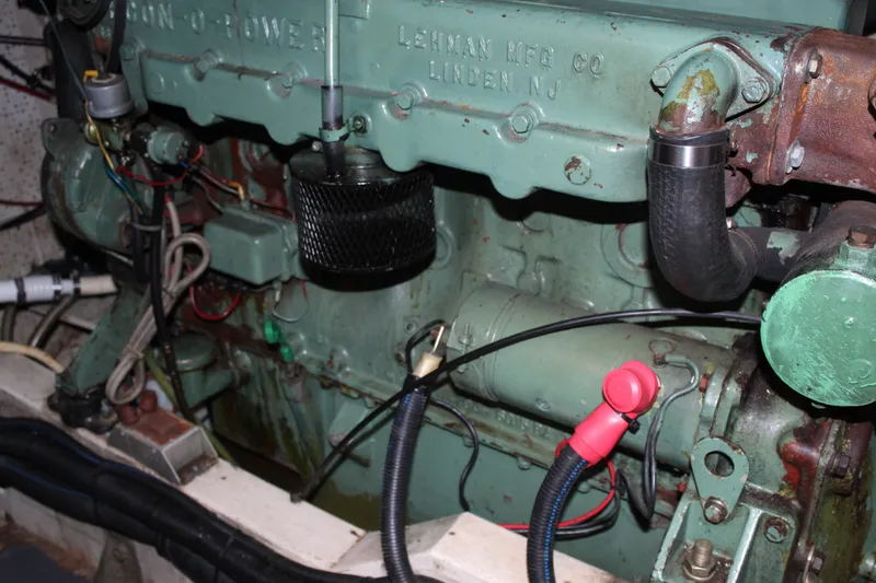 Slide: The Image of Engine of a 1971 Grand Banks 36 Classic boat, showcasing detailed mechanical components. - 33
