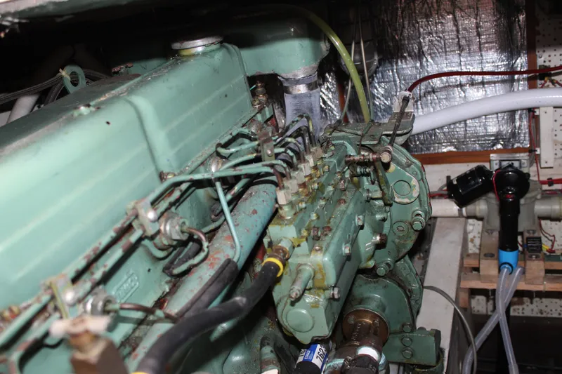 Slide: The Image of Engine room of a 1971 Grand Banks 36 Classic boat, showcasing mechanical components. - 34