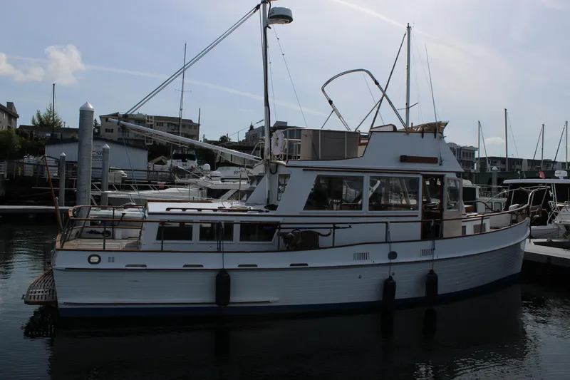 Slide: The Image of 1971 Grand Banks 36 Classic yacht docked at a marina. - 6