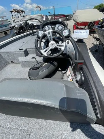 Slide: The Image of Interior of a 2022 Tracker 175 TXM boat with steering console. - 5