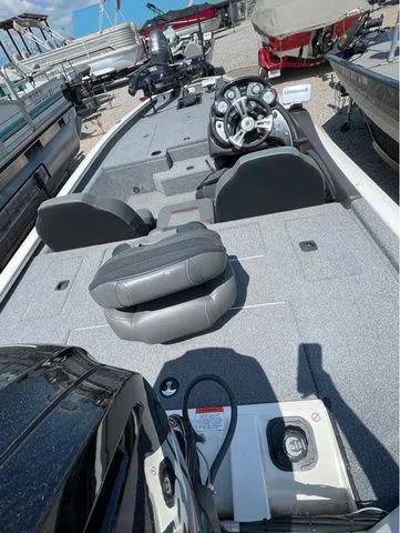 Slide: The Image of 2022 Tracker 175 TXM boat with gray interior and steering console. - 7