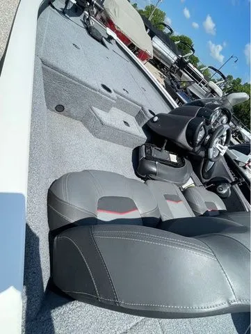 Slide: The Image of Interior of a 2022 Tracker 175 TXM boat with gray seats. - 8