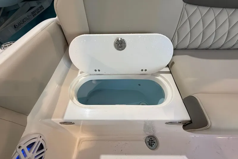Slide: The Image of Livewell compartment on a 2026 Key West 249 FS boat, featuring cushioned seating. - 19