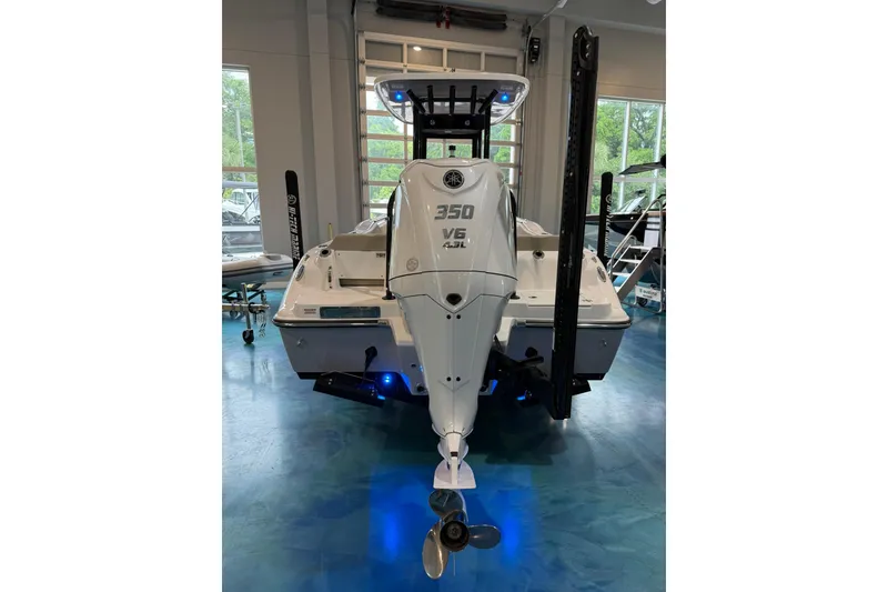 Slide: The Image of 2026 Key West 249 FS boat with powerful 350 V6 engine in showroom. - 3