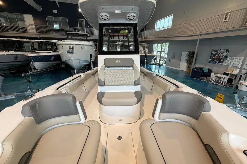 Slide: The Image of 2026 Key West 249 FS boat interior with luxurious seating in a showroom. - 8