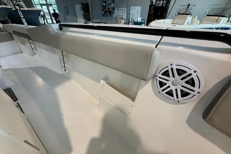 Slide: The Image of 2026 Key West 249 FS boat interior with speaker and cushioned seating. - 9