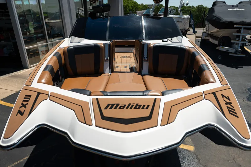 Slide: The Image of 2022 Malibu Wakesetter 23 MXZ boat with luxurious seating and sleek design. - 10