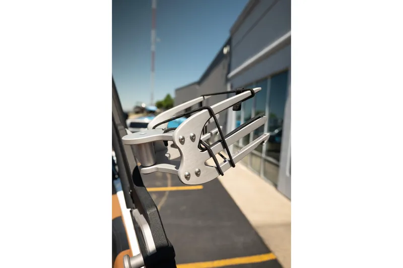 Slide: The Image of 2022 Malibu Wakesetter 23 MXZ wakeboard rack detail in a sunny outdoor setting. - 17