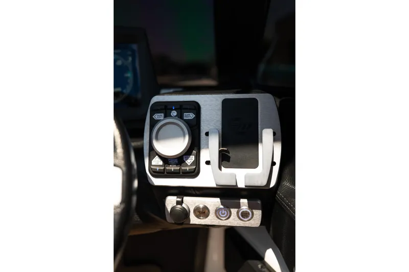 Slide: The Image of Control panel of 2022 Malibu Wakesetter 23 MXZ boat, featuring sleek design and modern controls. - 20