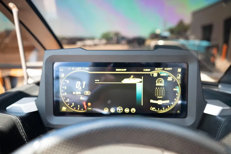 Slide: The Image of Dashboard display of 2022 Malibu Wakesetter 23 MXZ boat, showing speed and navigation data. - 22