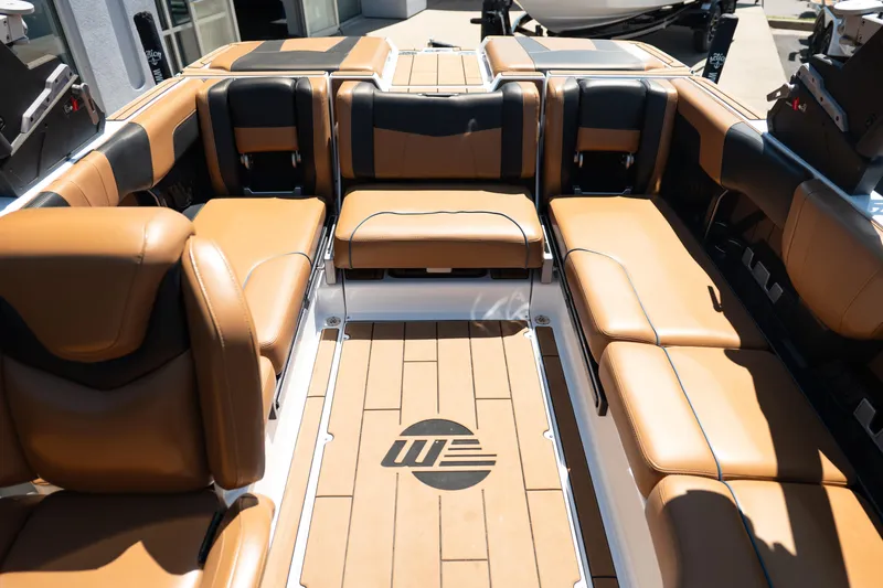 Slide: The Image of Luxurious interior of 2022 Malibu Wakesetter 23 MXZ boat with tan leather seating. - 23