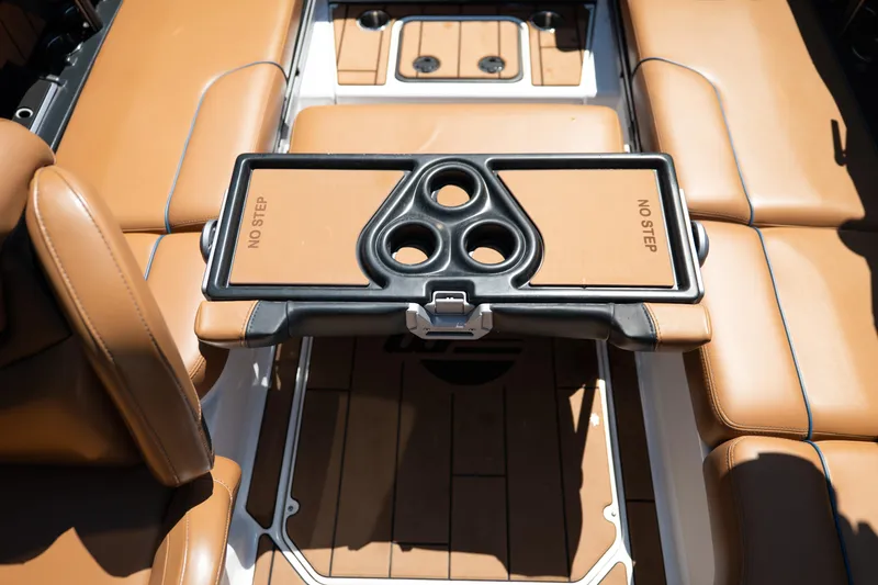 Slide: The Image of 2022 Malibu Wakesetter 23 MXZ interior with tan seating and cup holders. - 31