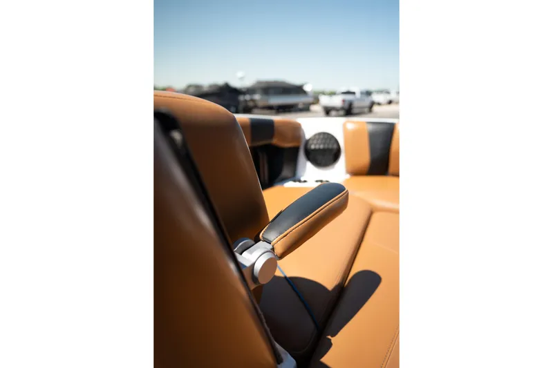 Slide: The Image of 2022 Malibu Wakesetter 23 MXZ interior with tan and black seating detail. - 33
