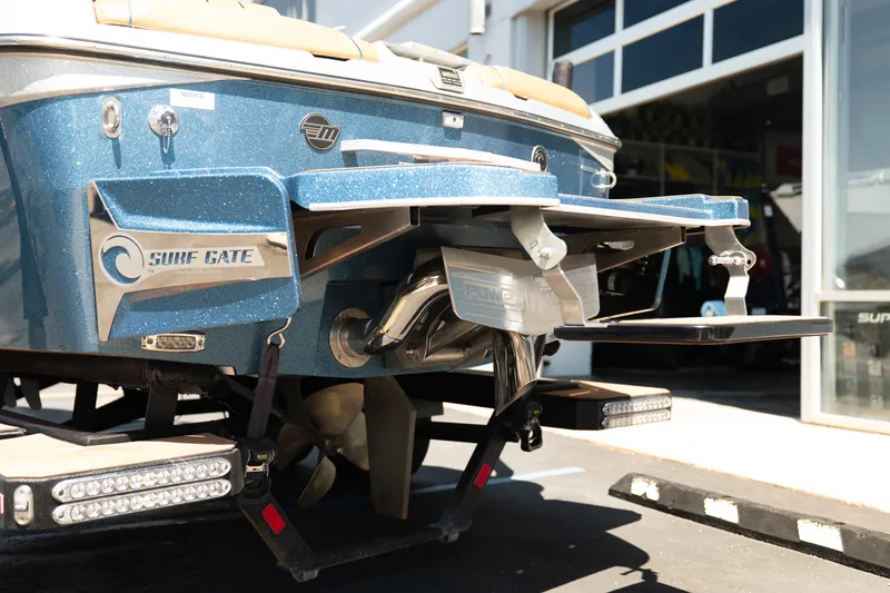 Slide: The Image of 2022 Malibu Wakesetter 23 MXZ boat with Surf Gate technology, rear view in sunlight. - 5