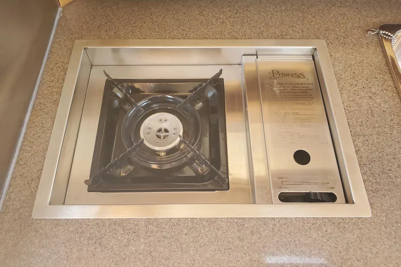 Slide: The Image of Stainless steel stove in 2013 Cutwater 26 boat galley kitchen. - 11