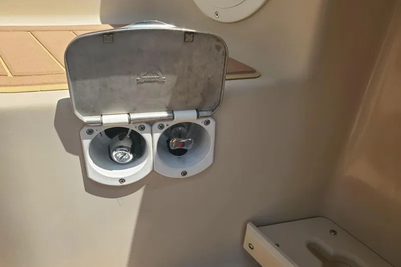 Slide: The Image of Outdoor shower controls on a 2013 Cutwater 26 boat. - 22