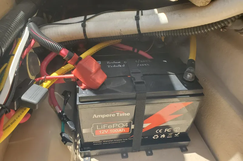 Slide: The Image of LiFePO4 battery installed in a 2013 Cutwater 26 boat, with visible wiring connections. - 26