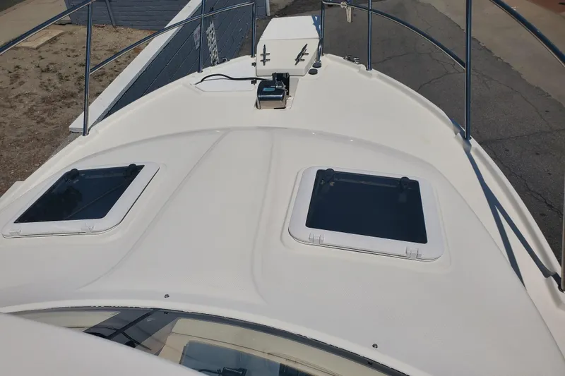 Slide: The Image of 2013 Cutwater 26 boat deck with hatches and railing, viewed from above. - 33