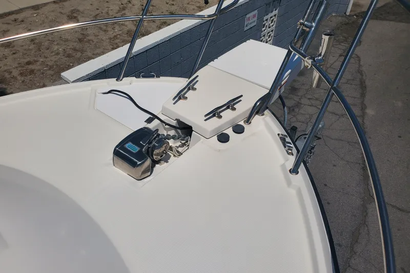 Slide: The Image of Bow of a 2013 Cutwater 26 boat with anchor and railing. - 34