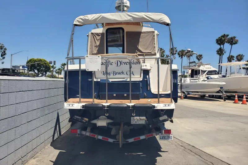 Slide: The Image of 2013 Cutwater 26 boat docked, rear view, sunny day, Long Beach, CA. - 4