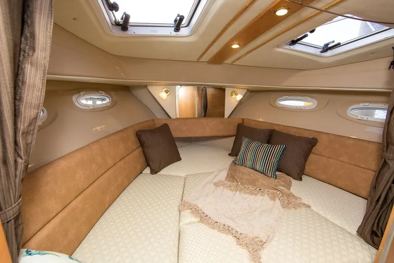 Slide: The Image of Manufacturer Provided Image: 2016 Cutwater 26 boat interior cabin with cozy bedding and pillows. - 46