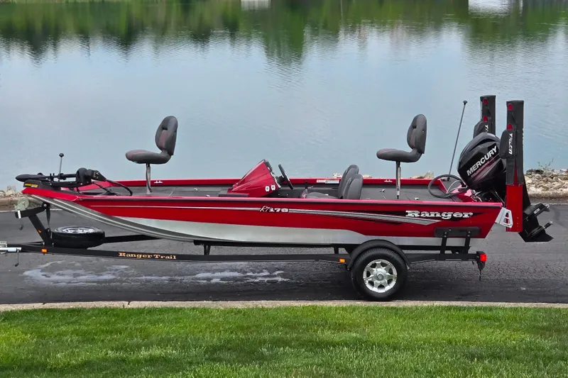 The Image of 2014 Ranger RT178 fishing boat on trailer by a lake. - 0