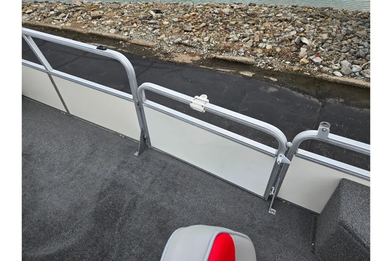 Slide: The Image of 2008 Sun Tracker Fishin' Barge 21 Signature Series deck with railing and carpeted floor. - 12