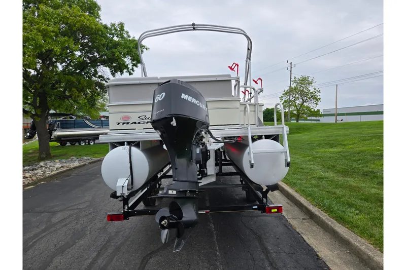 Slide: The Image of 2008 Sun Tracker Fishin' Barge 21 Signature Series with Mercury 60 engine on trailer. - 2