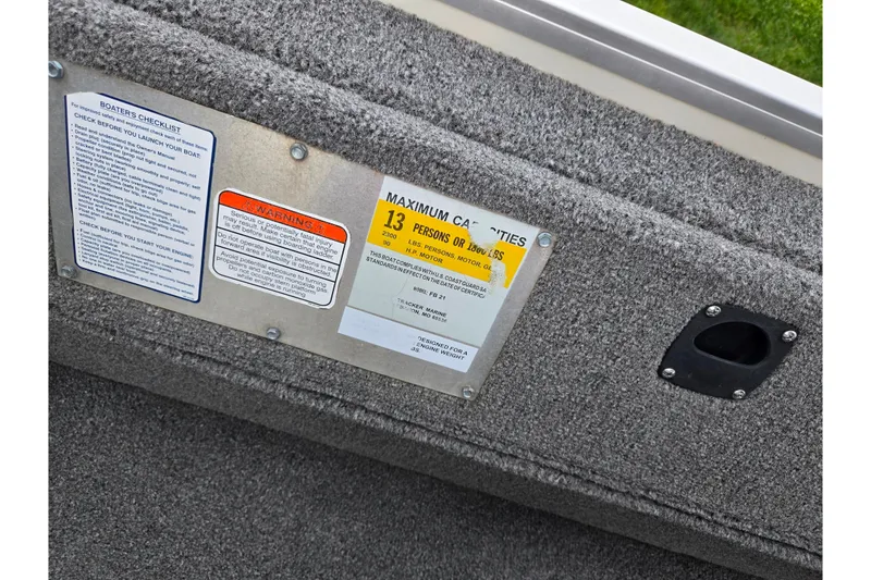 Slide: The Image of 2008 Sun Tracker Fishin' Barge 21 capacity plate, showing maximum capacity and safety warnings. - 21