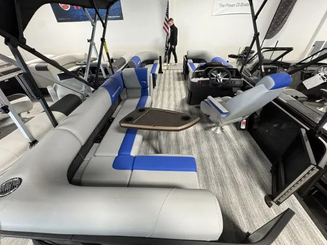 Slide: The Image of Interior of a 2026 Bennington 20 S L-BENCH pontoon boat with blue and gray seating. - 3