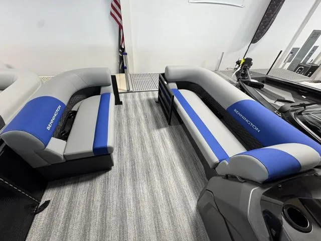 Slide: The Image of Interior of a 2026 Bennington 20 S L-BENCH boat with blue and gray seating. - 4