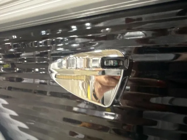 Slide: The Image of Close-up of a 2026 Bennington boat part, shiny chrome detail. - 3