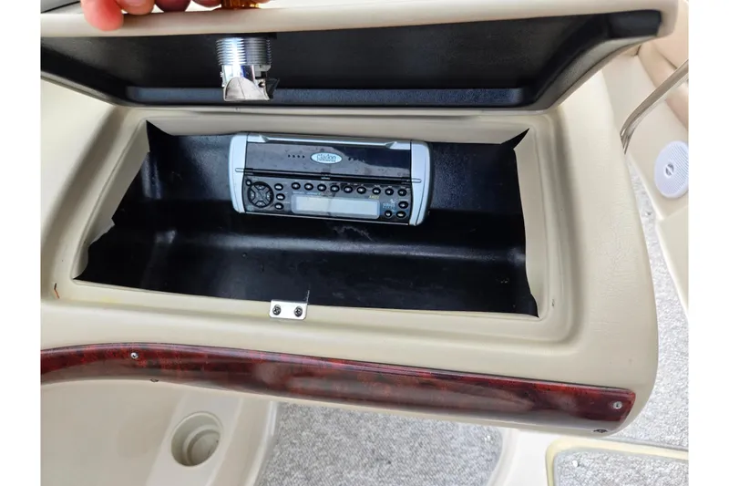 Slide: The Image of 2005 Glastron GX 205 boat dashboard with built-in stereo system. - 14