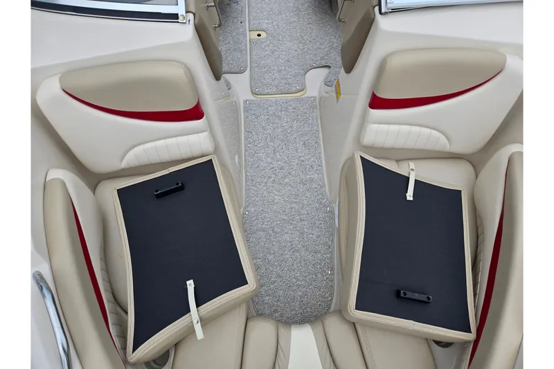 Slide: The Image of 2005 Glastron GX 205 boat interior with beige and red seating, carpeted floor. - 17