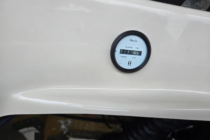 Slide: The Image of Hour meter on 2005 Glastron GX 205 boat dashboard, displaying elapsed time. - 23