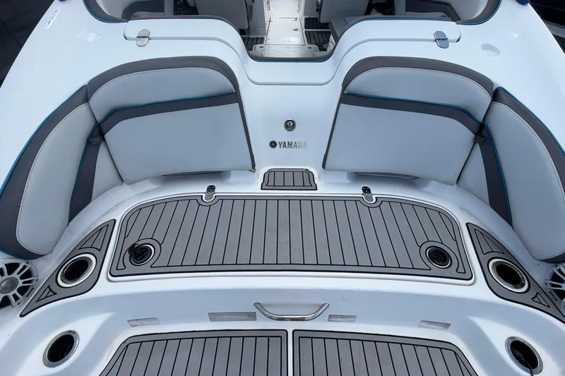 Slide: The Image of 2020 Yamaha Boats AR240 swim platform with cushioned seating and cup holders. - 13