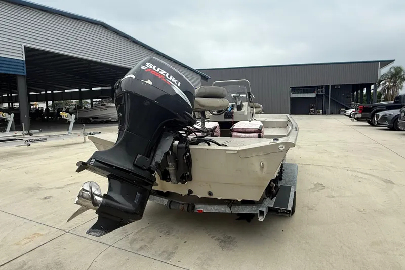 Slide: The Image of 2008 SeaArk 1652 MV boat with Suzuki outboard motor in a marina setting. - 3